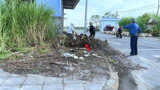 The rich man reacted with surprise when he saw us cleaning up trash and grass next to their house