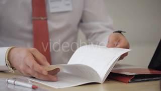 Businessman Exploring Info From Open Booklet - Stock Footage | VideoHive 15169686