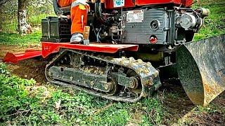 25hp crawler tractor performing in a small garden 