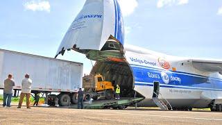 Antonov An-124 Ruslan, Volga Dnepr • Russian Plane Unload a Truck and Pickup Trucks