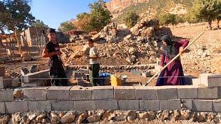 Walls up: Akram and her children continue to build the barn with strength