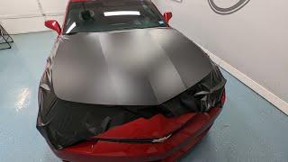 Before & after Camaro hood wrapped in Hexis Deep Black Satin vinyl wrap.