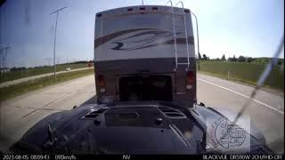 Dash cam video of Jeep coming off of dolly behind RV