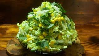 A simple salad for a holiday or every day. Salad of Chinese cabbage, cucumber, egg and corn.