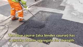 Tarmacadam patch repair in residential road