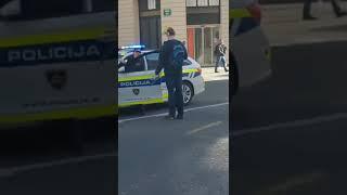 Slovenian police woman shows her back to the guy with 2 knifes in his hands! Slovenska Policija 