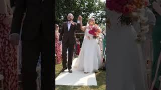 Bride and Groom walk up the aisle