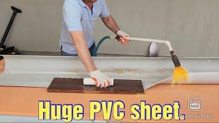 How to turn a huge PVC pipe into a flat sheet.