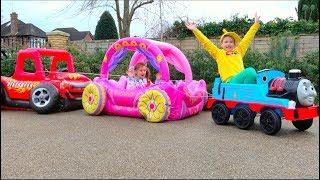 Max and Katy playing with Ride-on Toy Cars