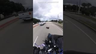 DOG JUMPS OUT OF TRUCK WINDOW TOWARDS BIKER