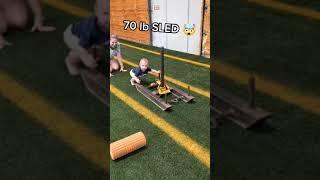 Toddler Pushes Heavy Sled Across Dad's Gym - 1306902