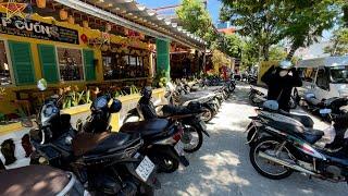 Walking the streets in Da Nang to exchange money.