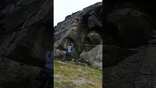 Lead climbing Twisting Crack at High Neb, Stanage North