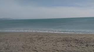 Sacaba Beach Malaga on a sunny but windy winters day