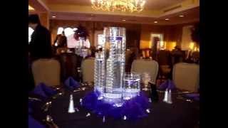 Floating Candle Centerpieces in Purple by Sweet 16 Candelabras