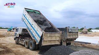 Dump truck unloading Gravel mix, Mini Excavator Push clear for building foundation apartment's Road