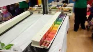 Cutting into a surprise 74-layer rainbow cake