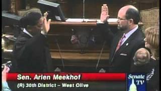 State Sen. Arlan B. Meekhof, R-West Olive, is administered the oath of office