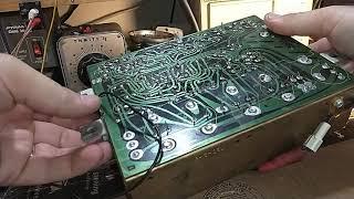 Diagnose and repair a 1960s Magnavox transistor amp with a noisy channel.