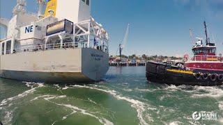 This is how big ships are pulled by tug boats in Maine