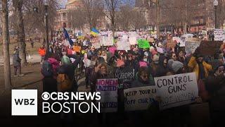 Around 2000 people march in Boston for women's rights on International Women's Day