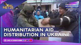 Russian state tv shows images of humanitarian aid distribution in Mariupol