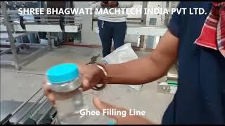 Four Head Viscous Ghee Filling machine, Induction Cap Sealing Machine, Turn table