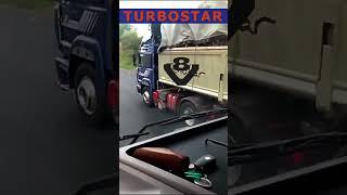 A vintage Iveco truck with a loaded trailer makes a loud sound while overtaking