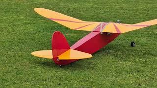 Red Zephyr vintage RC plane goes for a spin.