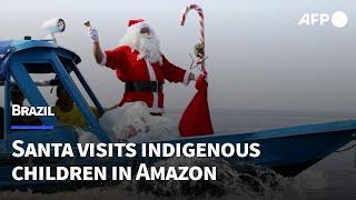 Santa visits indigenous children in Brazilian Amazon community | AFP