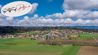 Drone Time lapse with Grossaffoltern and the Jura chain in the background in Switzerland