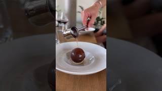 Chocolate sphere flambé with rum raisin ice cream #dessert #amazing  #chocolateball #delicious