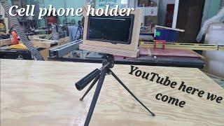 Cell phone holder for recording YouTube videos. Connects to a tripod for those close up shots