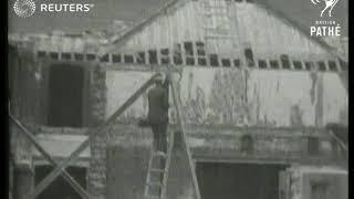 Workmen dismantle 'Bidston Court' Mock Tudor house for relocation to Frankby (1930)