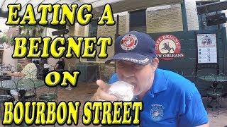 Eating a Beignet for the First Time on Bourbon Street