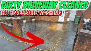 Pressure washing a dirty driveway