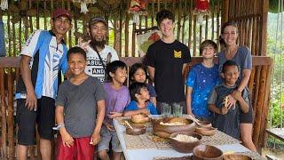 A hike into the rice fields, visiting farm animals, and eating a cassava snack!