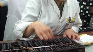 Chinese Pharmacy Clerk Using Abacus