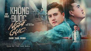 KHÔNG ĐƯỢC NGÃ GỤC - DANH TUẤN TRUNG | MV OFFICIAL | mình không được phép để ngã gục...