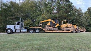 Bell Ultra T Track Feller Buncher cutting and shoveling hardwood on steep ground