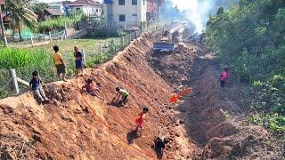 Start a new project a great landfill with a small truck carrying dust and machine Komatsu push soil