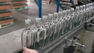 Limitation of bottles flow before inspection machine