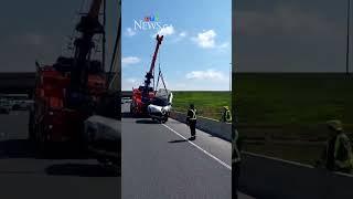 Woman charged after driving into pond