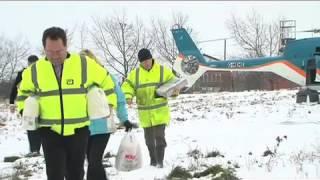 KOS Media helicopter care packages during heavy Snowfall