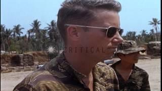 US officer observes captured ammunition while Army of Republic of Vietnam(ARVN) t...HD Stock Footage