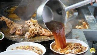 Insane Beijing Street Food -  large bowl of pork intestines, fat, and braised soup