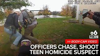 Police body-cam video shows officers shooting at suspected teen killer