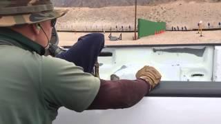 Al shooting out of the truck bed cover/concealment exercise AK Operators Course