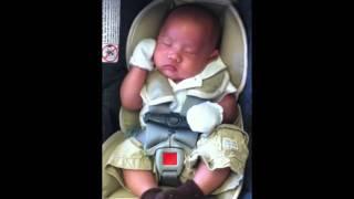 Hudson sleeping in his car seat