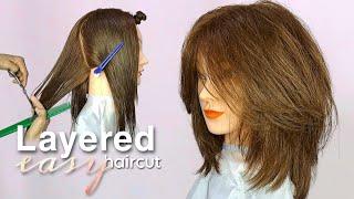 LAYERED HAIRCUT with long curtain bangs